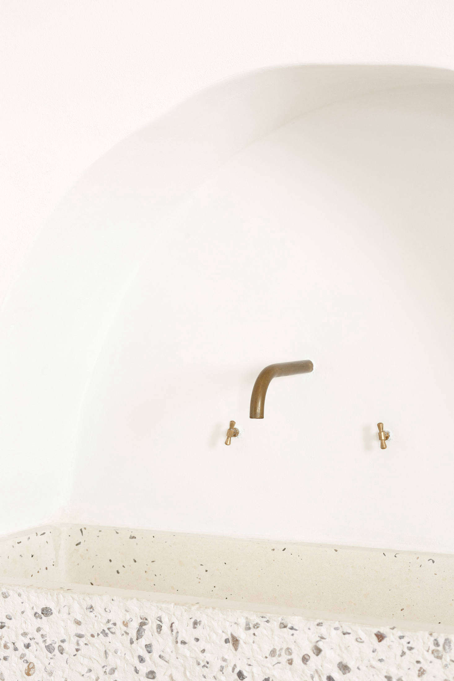 The tap is made of a bent brass pipe.