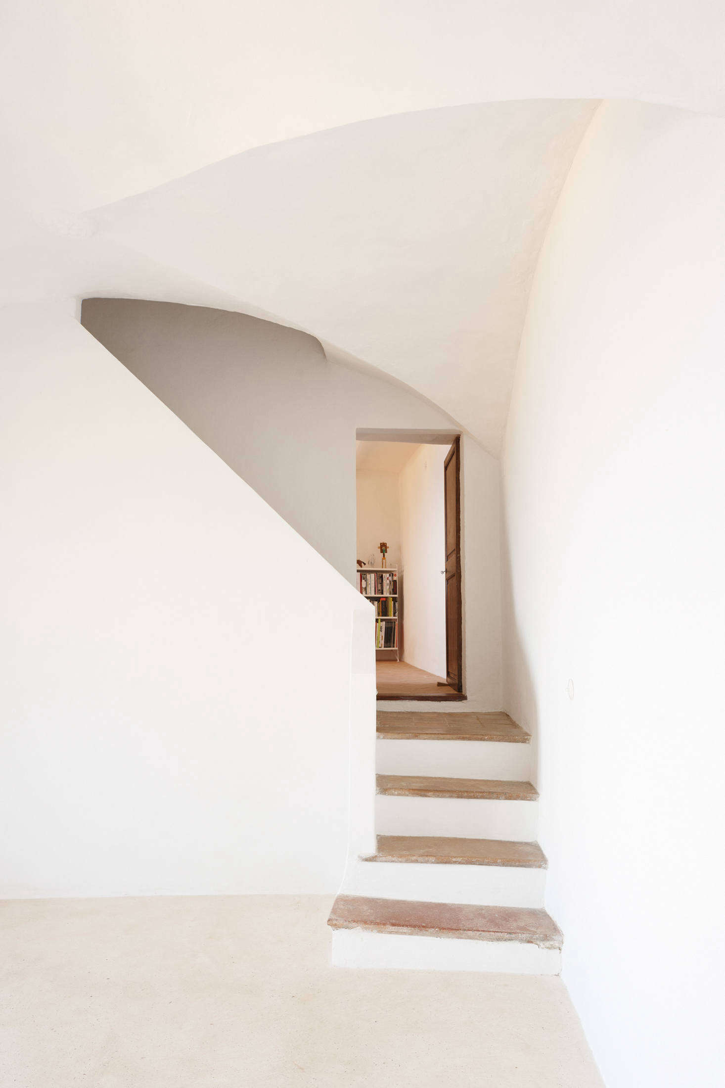 Back in the kitchen area, the other stairway leads up to the library.