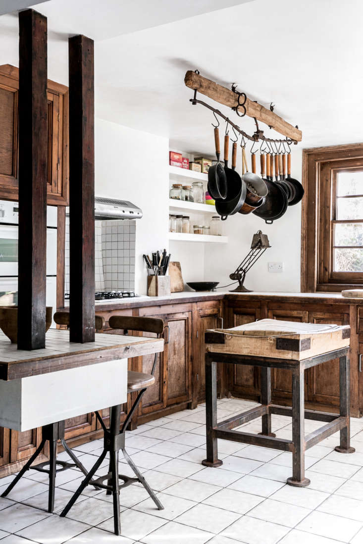 a hewn beam becomes a sophisticated pot rack in kitchen of the week: artis 19