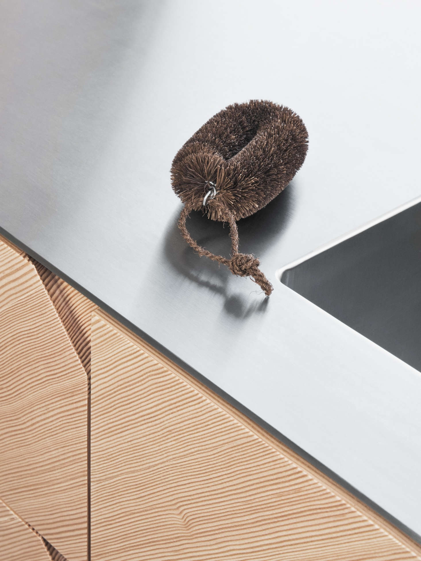 For the counter, Manz recommends applying a floating stainless steel counter, five or eight millimeters thick. The floating look is achieved by inserting strips of MDF that are recessed from the edge. Reform offers the counter with a seamlessly welded Lavabo sink for $3,600. Solid wood, linoleum, laminate, and concrete countertops are also available.