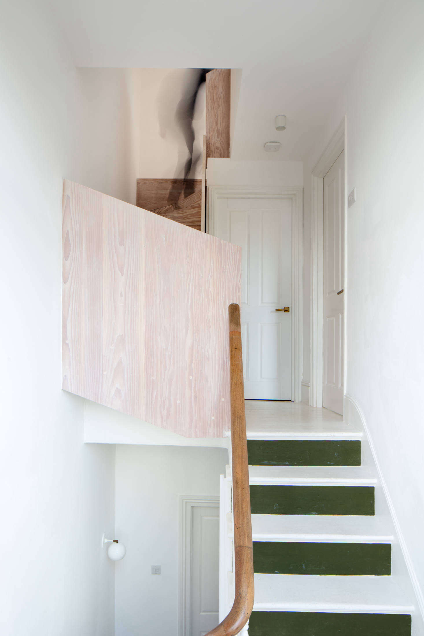 While the couple splurged on the kitchen and Dinesen flooring, they saved money where they could, like painting what Toke calls the upstairs 