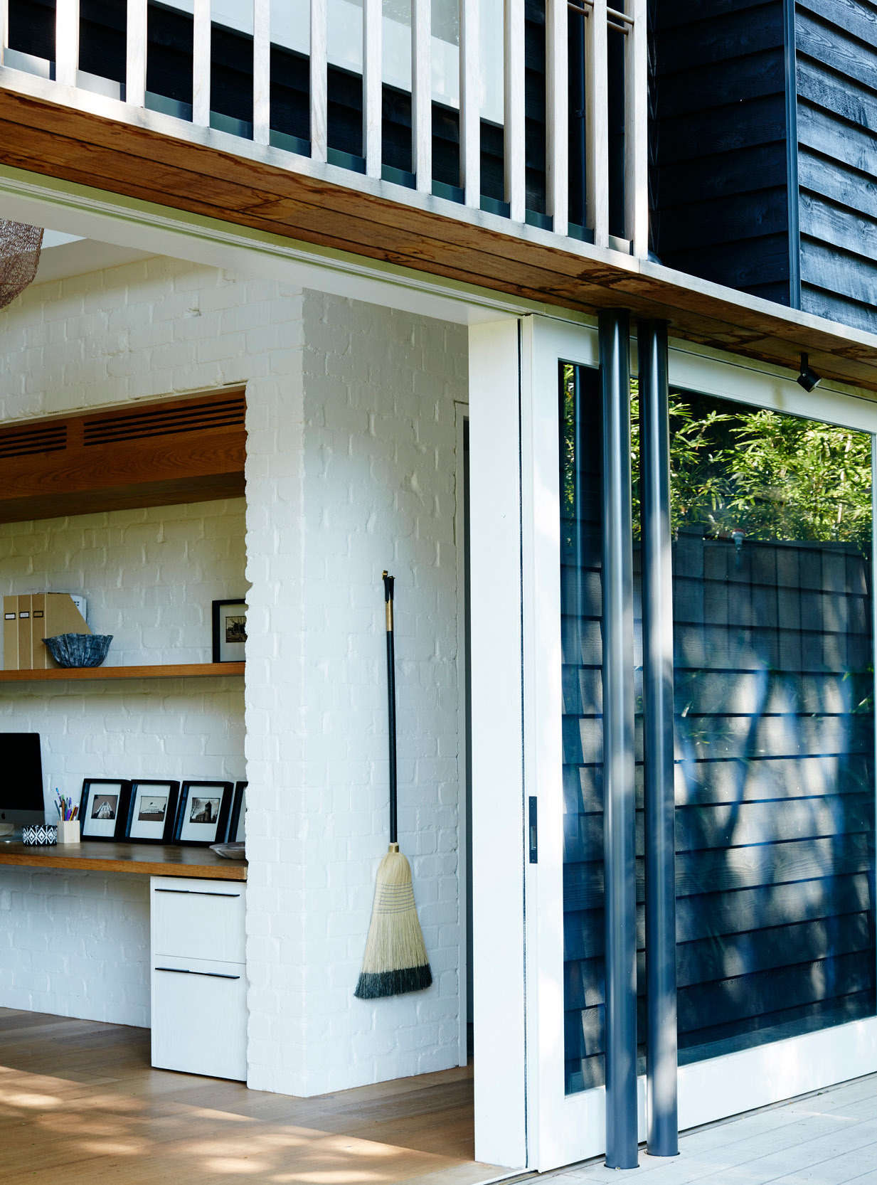 Also in Australia, an architect displays a black-accented broom that complements his home