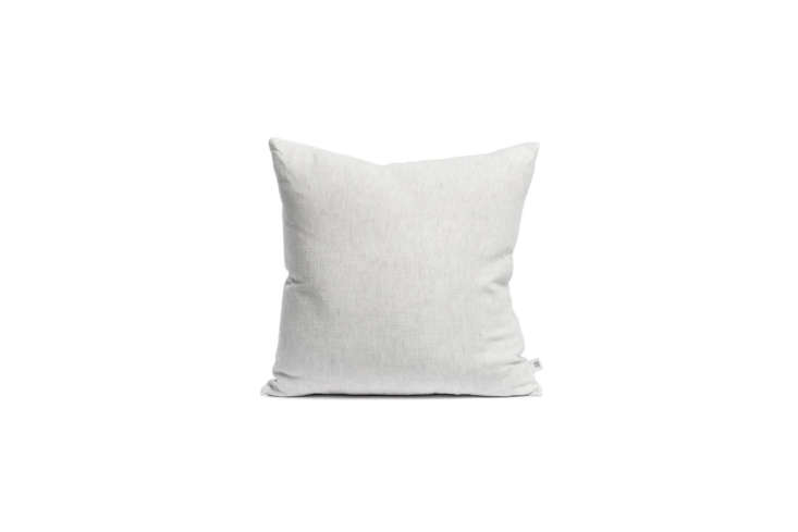 the lightest of the throw pillows is the by mölle misty grey linen cushion; � 31
