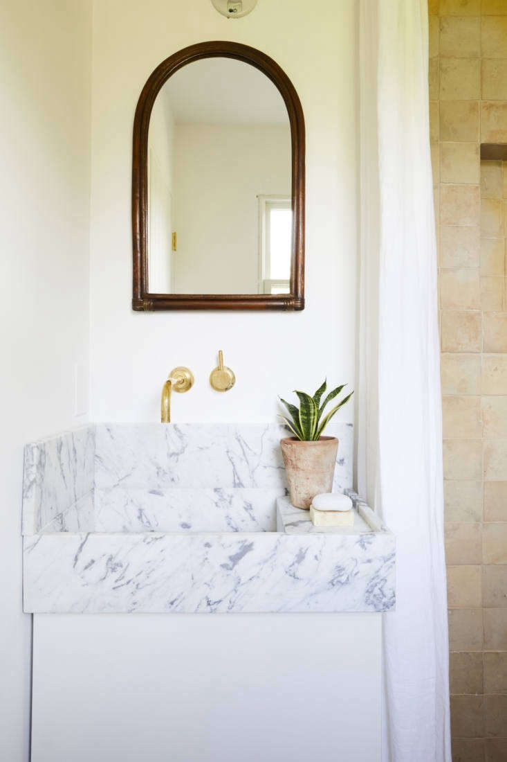 the bathroom, with a compact marble sink and tiles from cle tile. 24