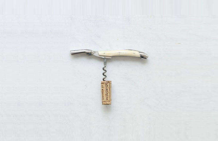 A stainless steel and bone Sommelier Wine Opener made by La Forge de Laguiole for The Cook