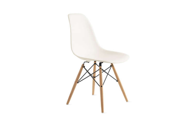 the eames molded plastic dowel leg side chair with a white shell and maple legs 28