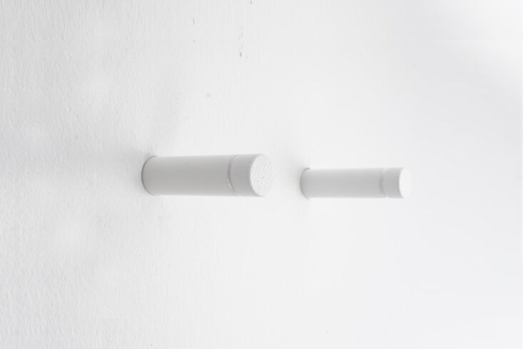 the peg rail seen leading into the dining room is made up of individual pegs in 27