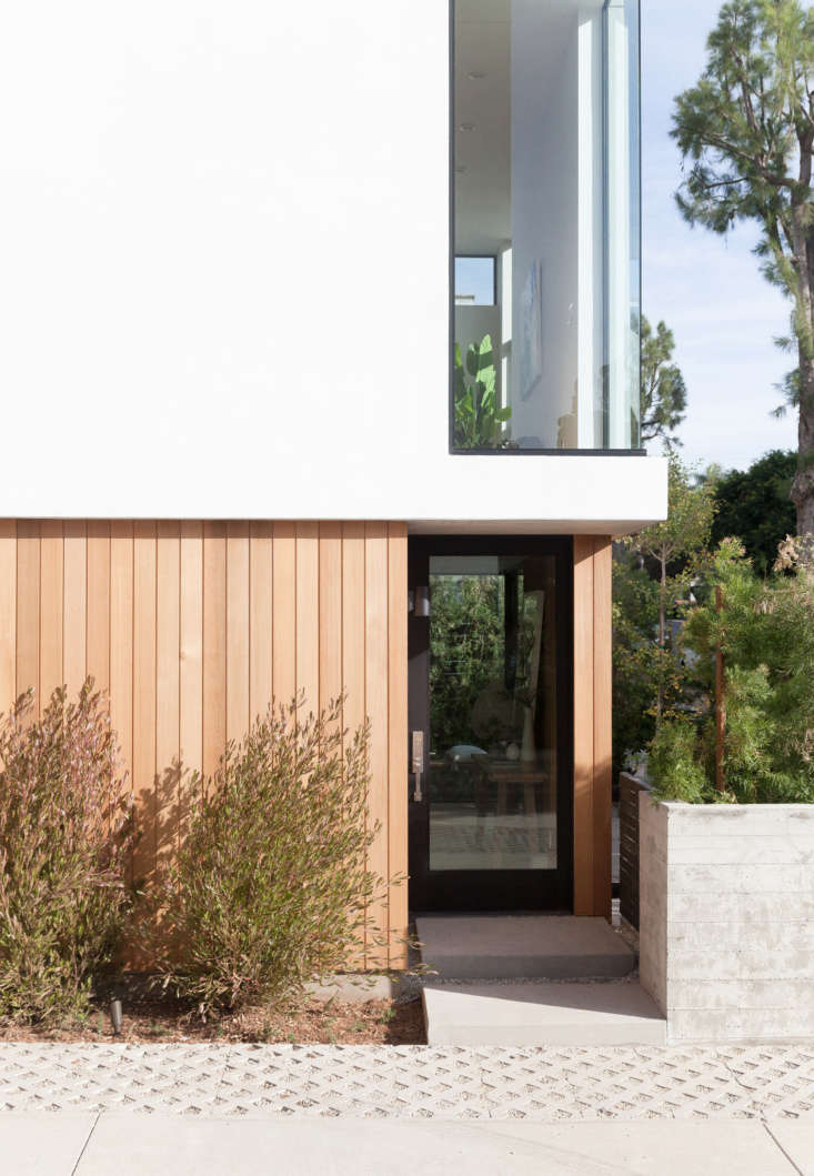 each unit has a private entrance. cedar cladding adds to an organic, rather tha 18