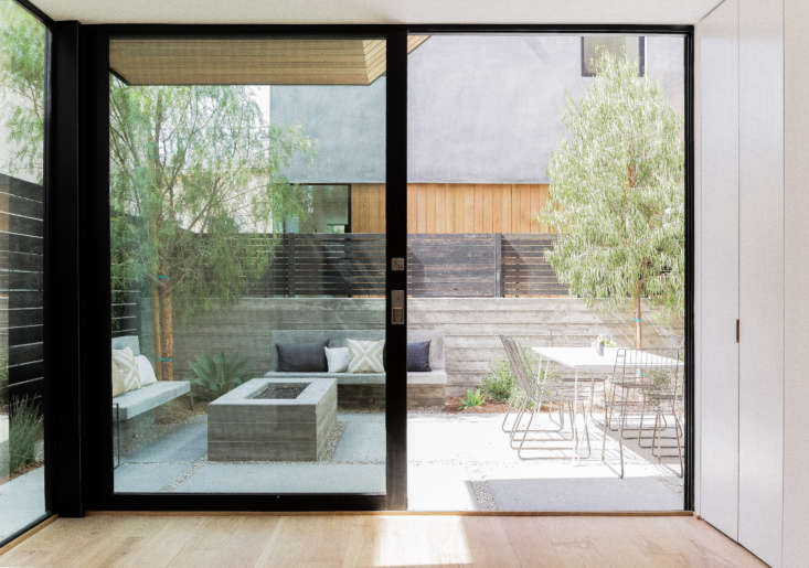 another patio, with poured in place concrete walls for privacy and a concrete f 26