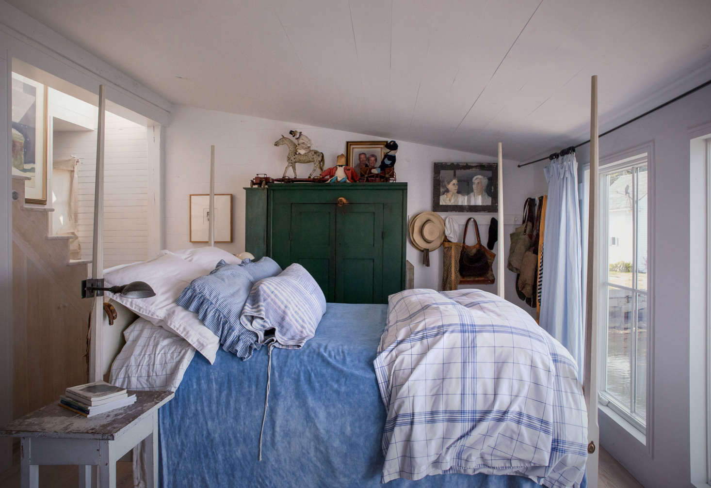 On a bed purchased from Leonards in Rhode Island, the couple paired Ralph Lauren bedding with a hand-dyed, linen, top-spread from France.