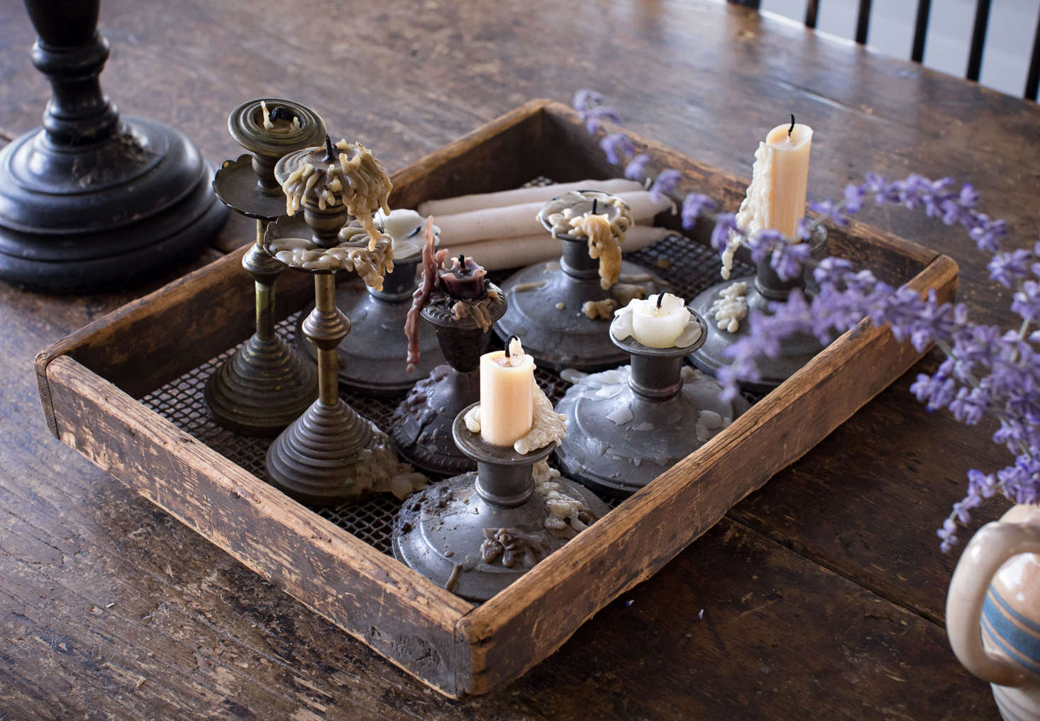 Sharon and Paul love burning beeswax candles in their collection of candlesticks, which includes American pewter as well as brass sticks that were a gift in the 70s from Sharon