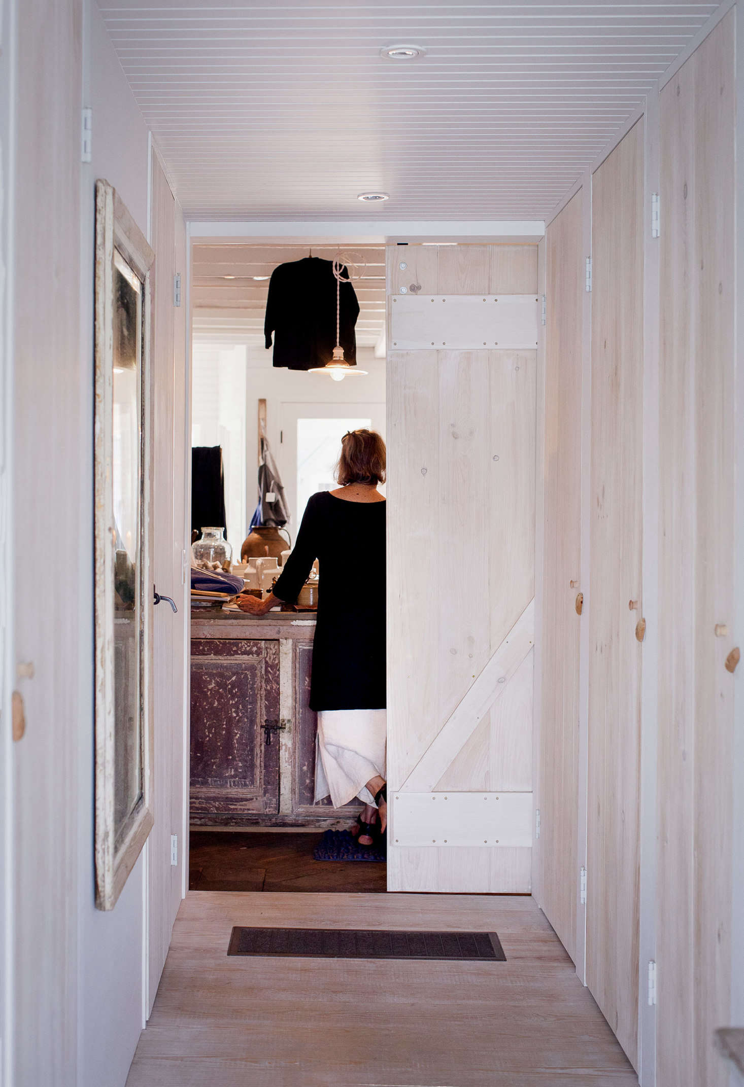 A hallway, flanked by the master bath and ample closets, leads from the back bedroom to the storefront.
