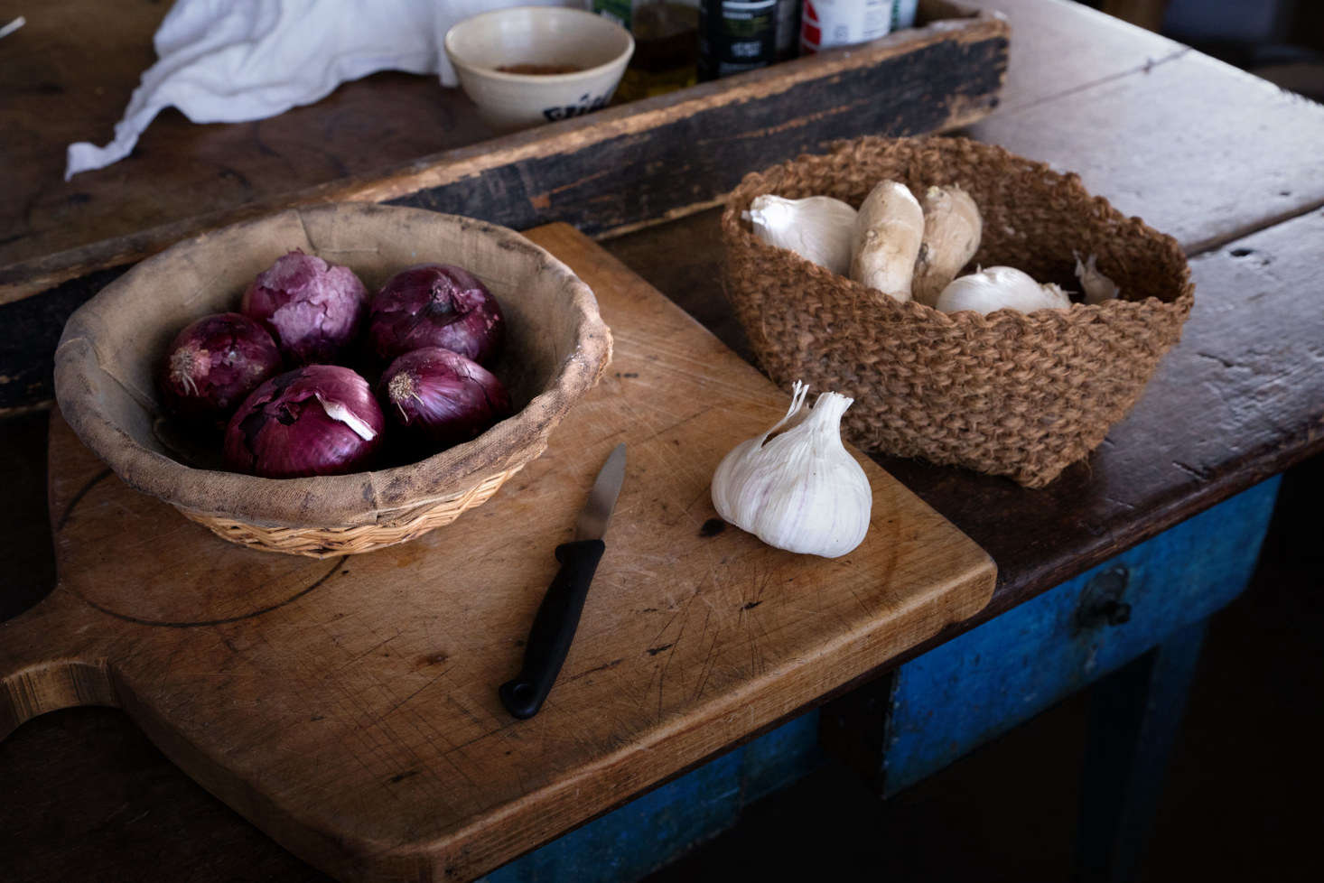 Meal prep occurs on the center island, an American table that Sharon and Paul raised with copper leg extensions.
