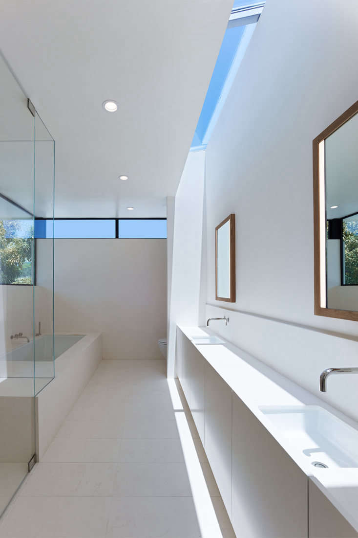 a skylight and clerestory windows light the master bath, which is almost entire 30