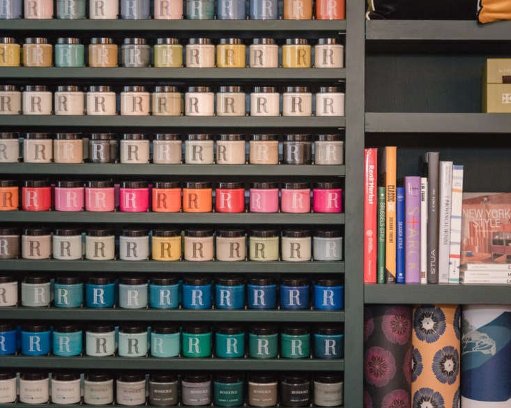 tester sized jars of paint lined up in the new york city showroom. ressource of 17