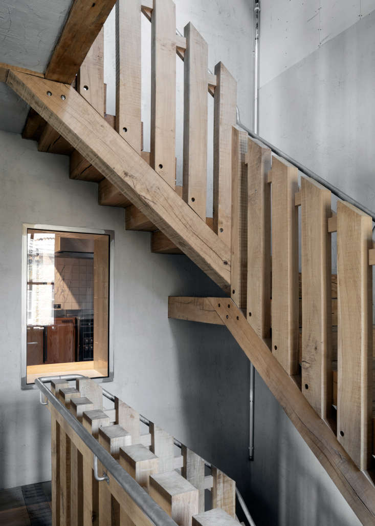 a central oak stair serves as the spine of the building. an oak framed window o 18