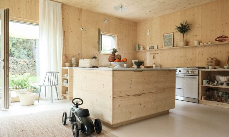 all the cabinets in the kitchen are made of the same wood as the walls and ceil 18