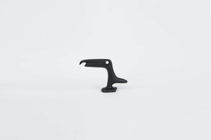 the japanese made cast iron bird bottle opener, in the shape of an abstract cro 21