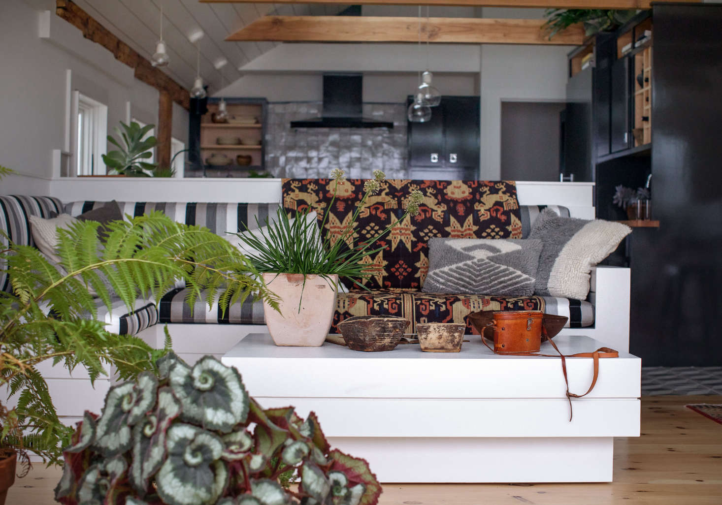 Low, built-in banquettes in the living area allow for an unobstructed view of the water from the kitchen.