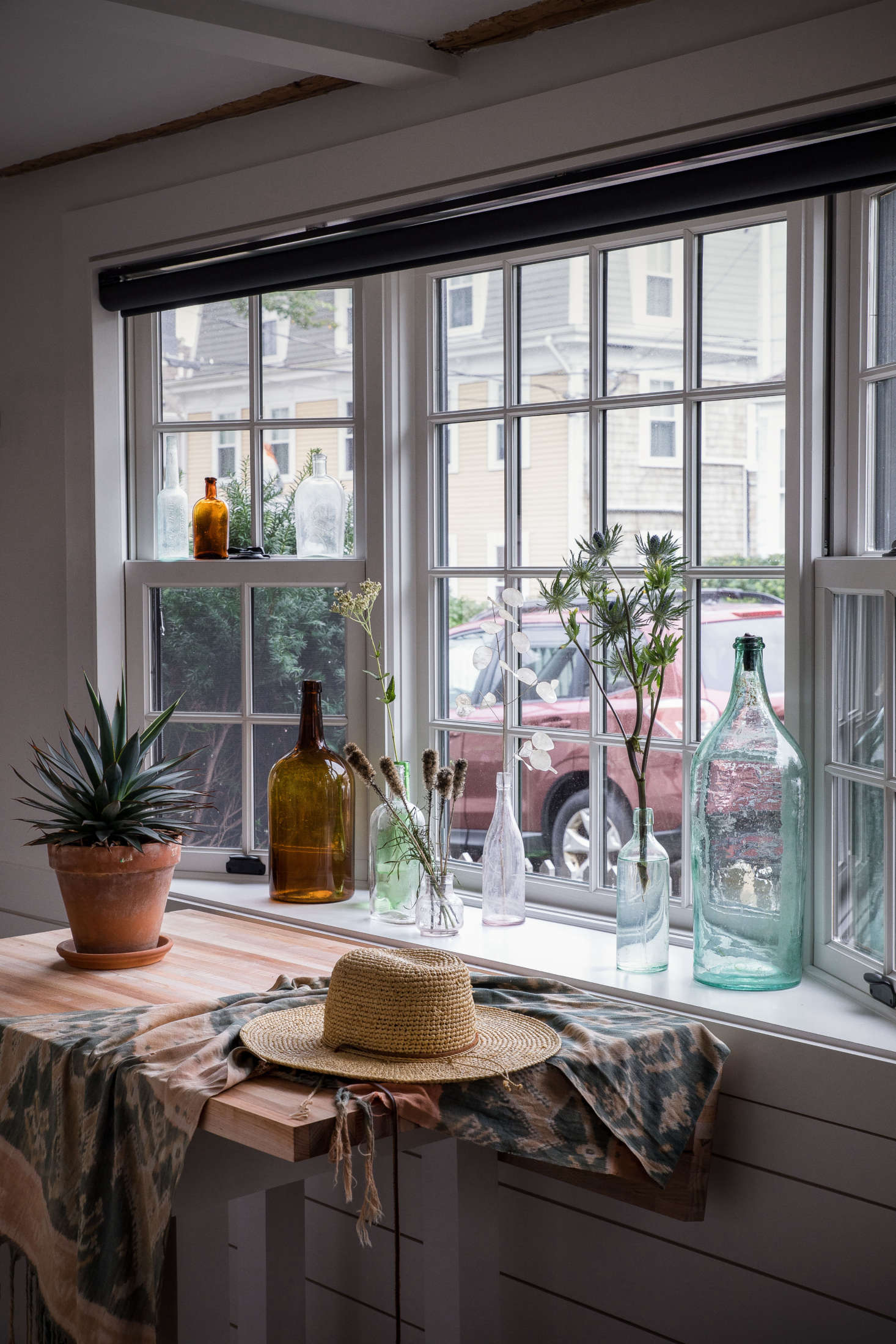 The studio is illuminated by a generous bay window that overlooks bustling Commercial Street.