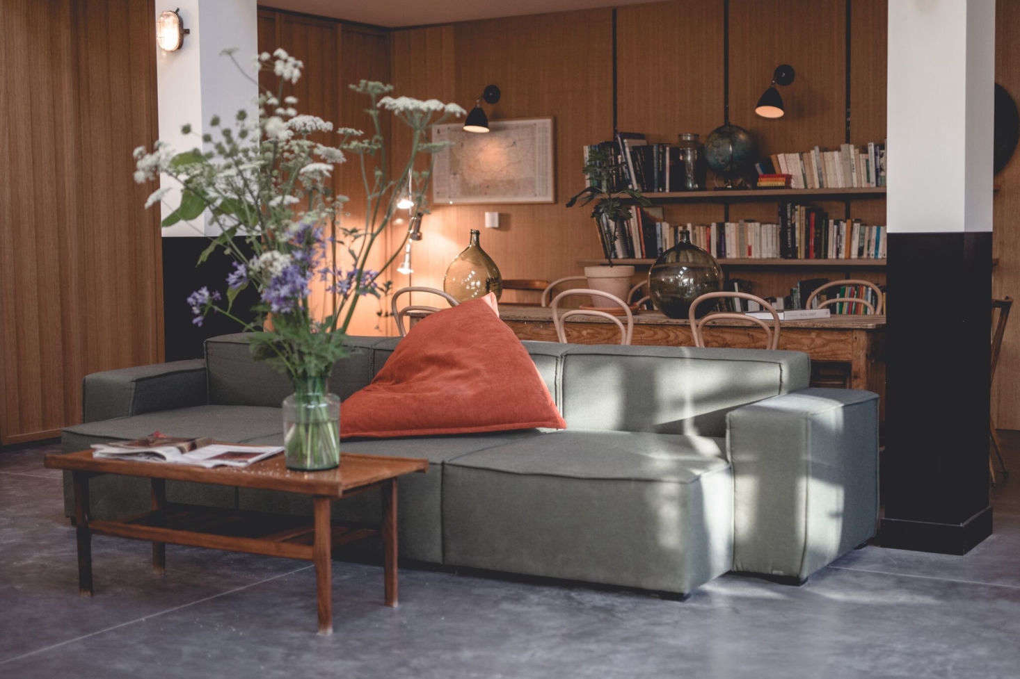 An extra-wide sofa for lounging in the library area.