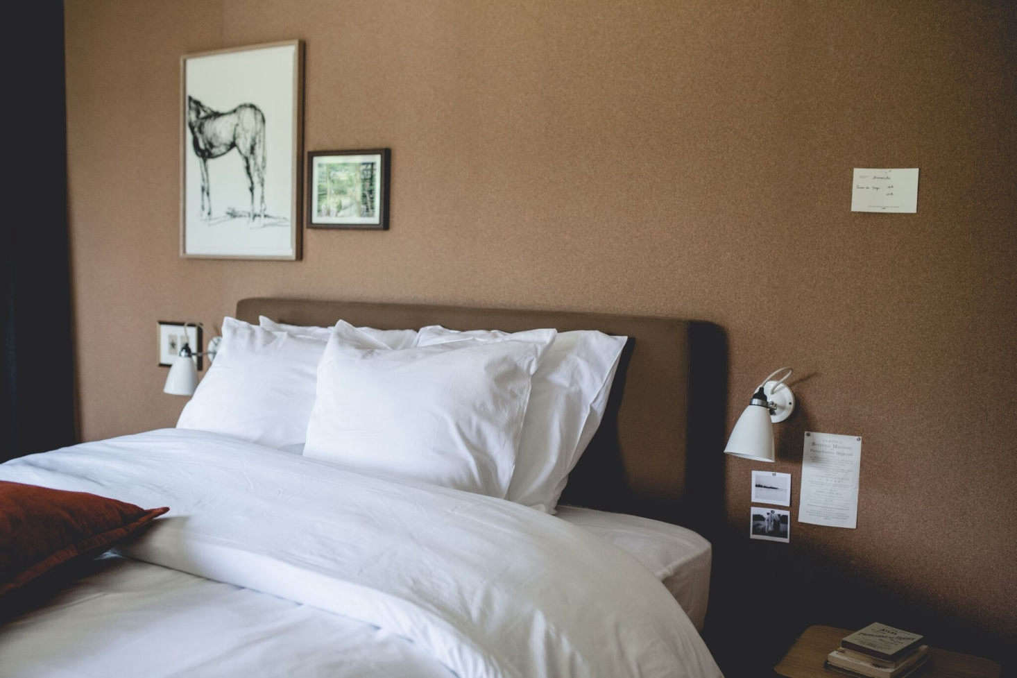Beds are set against cork-lined walls ideal for displaying art.
