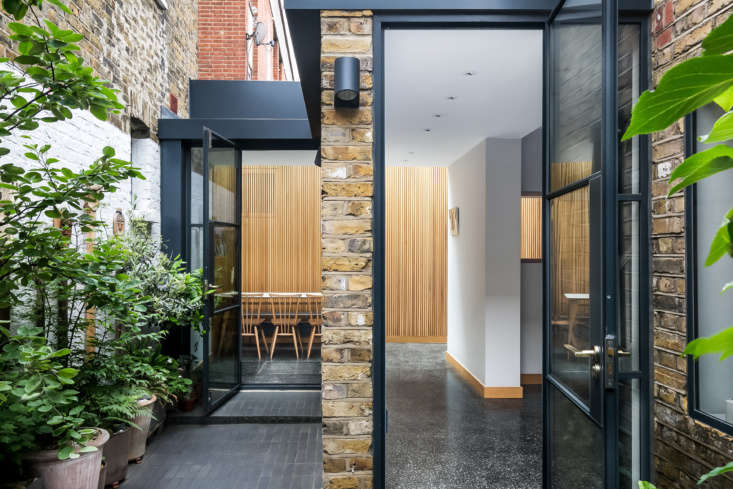  steel framed glass doors lead into the front hall and the dining room. 20