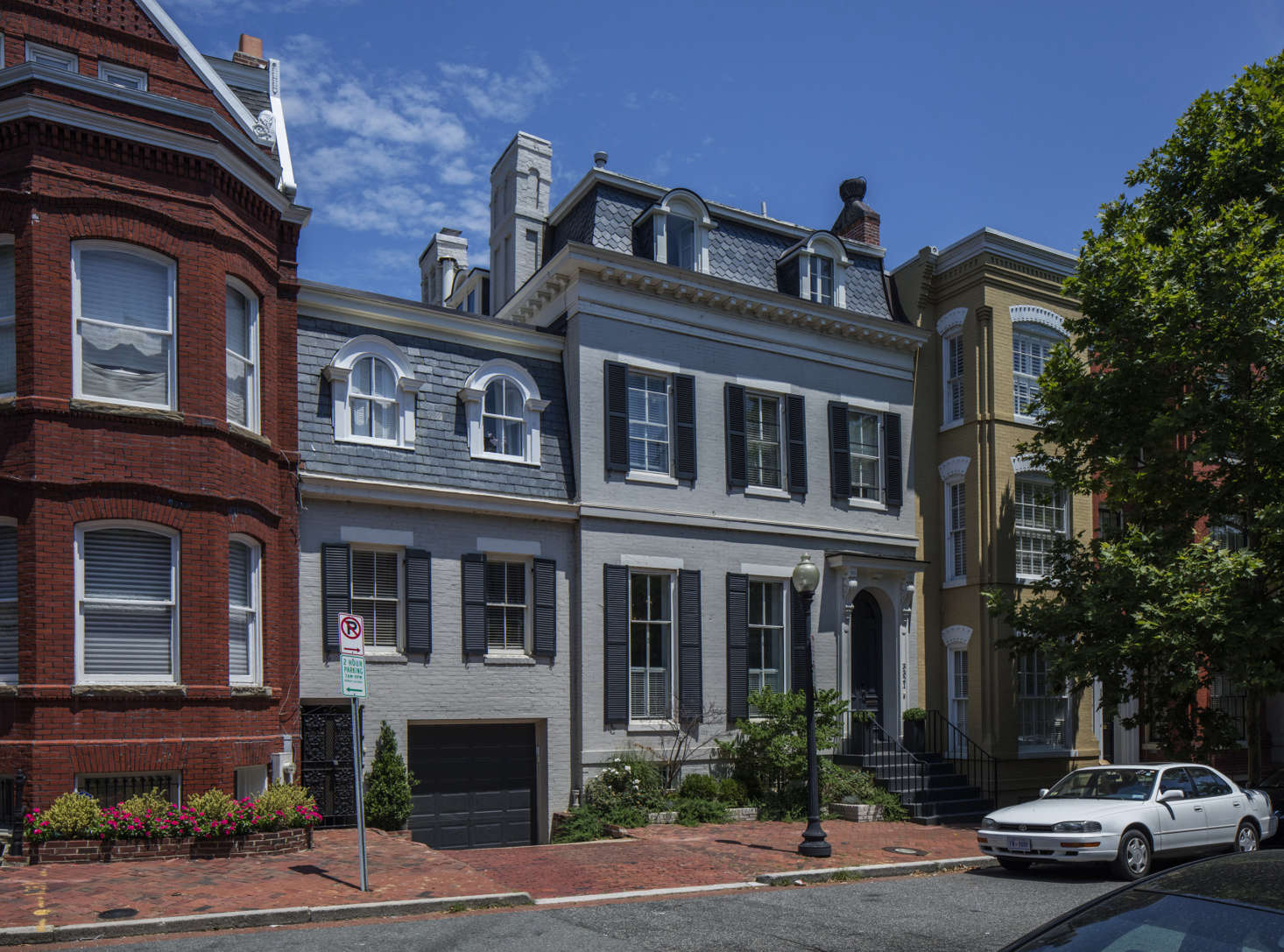 Built in the mid-th century, the mansard-roofed Victorian with attached carriage house is three doors from JFK