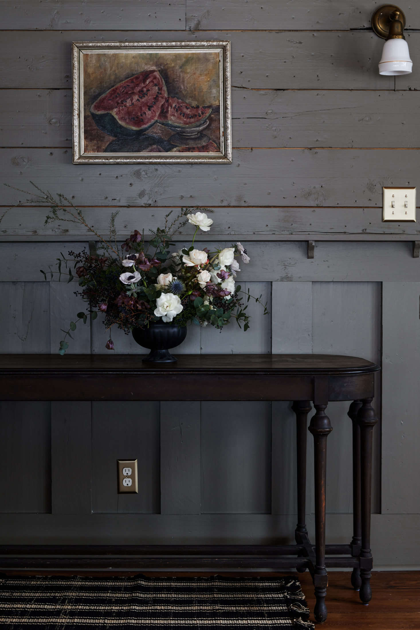 In the dining room, Tara and Percy restored a vintage side table that came with the house.