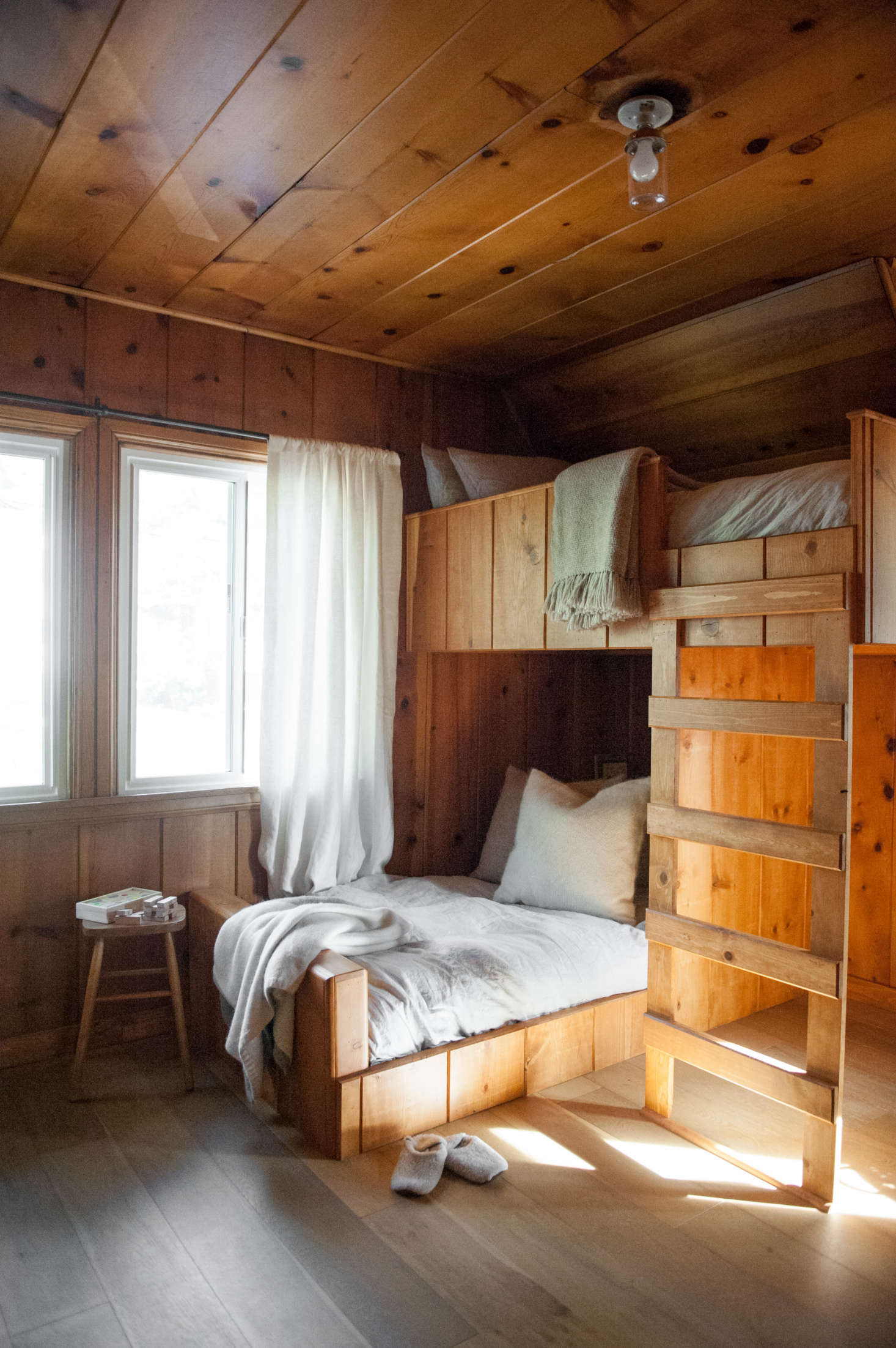 Lauren designed the custom bunk beds to continue the lines of the existing paneling.