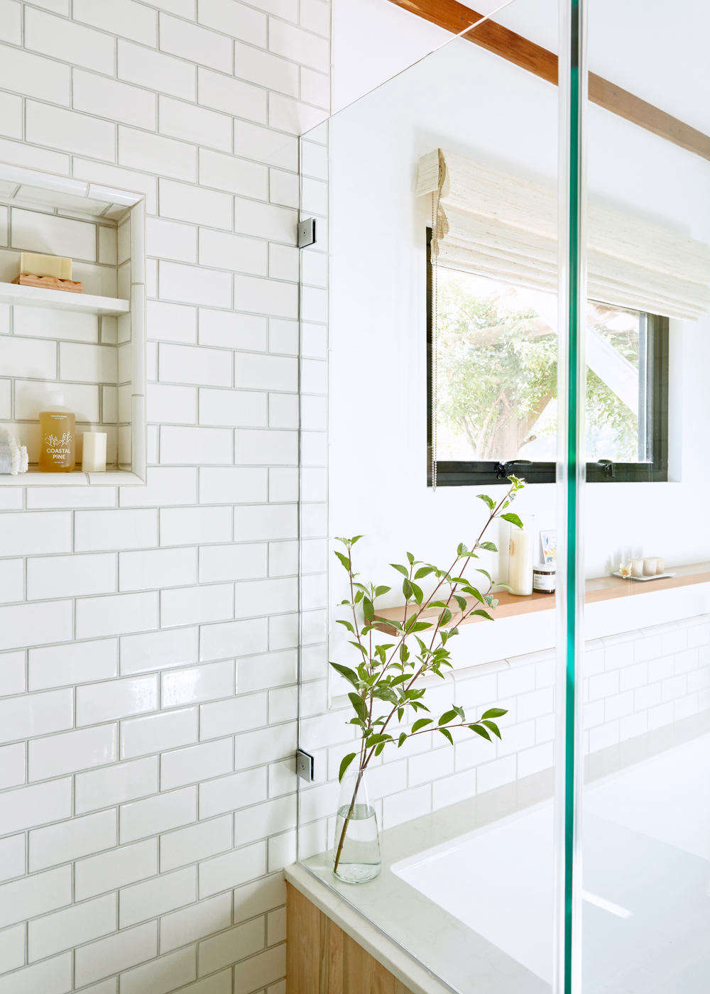 To bring more light into the bathroom, Lois installed a custom steel window from Bonelli, a San Francisco window manufacturer. The Roman shade is from The Shade Store.
