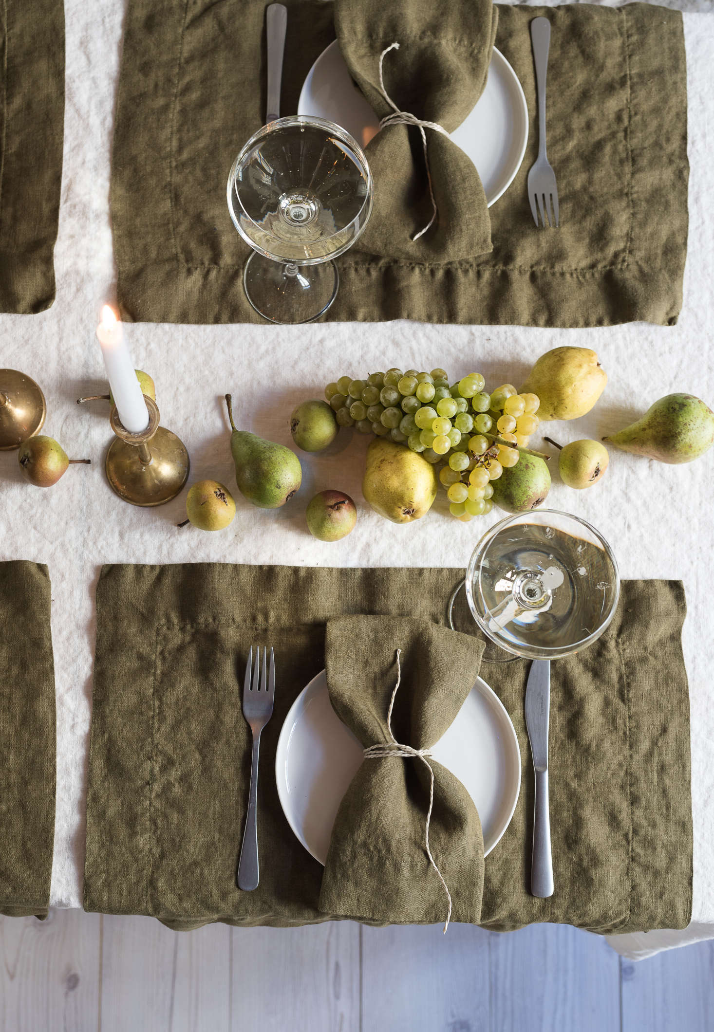 Fruit becomes a jewel-toned centerpiece when laid artfully down the center of the table.