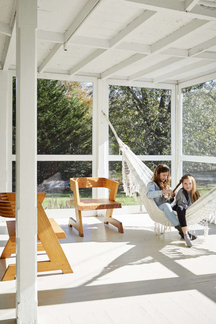 the burden girls hang out on the screened porch in a hammock that the family br 28