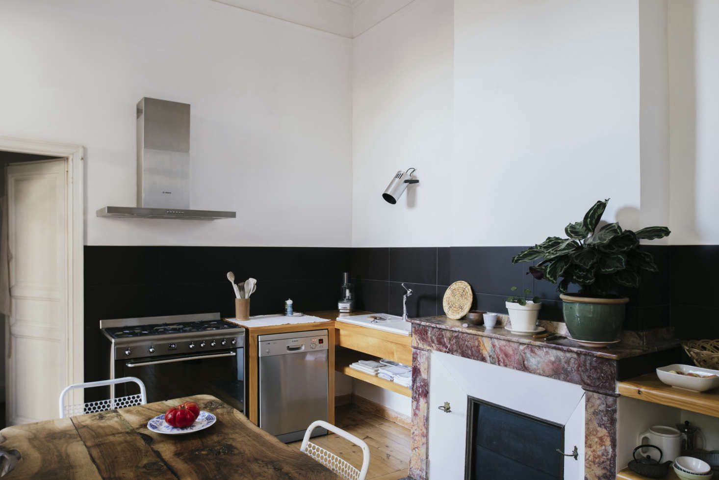 Sathal designed the simply fitted kitchen around the mantel. 
