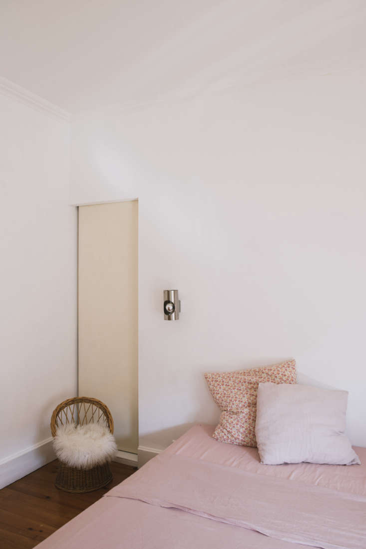 a bedroom with pink linens and silver wall sconces. &#8\2\20;i make all of  40