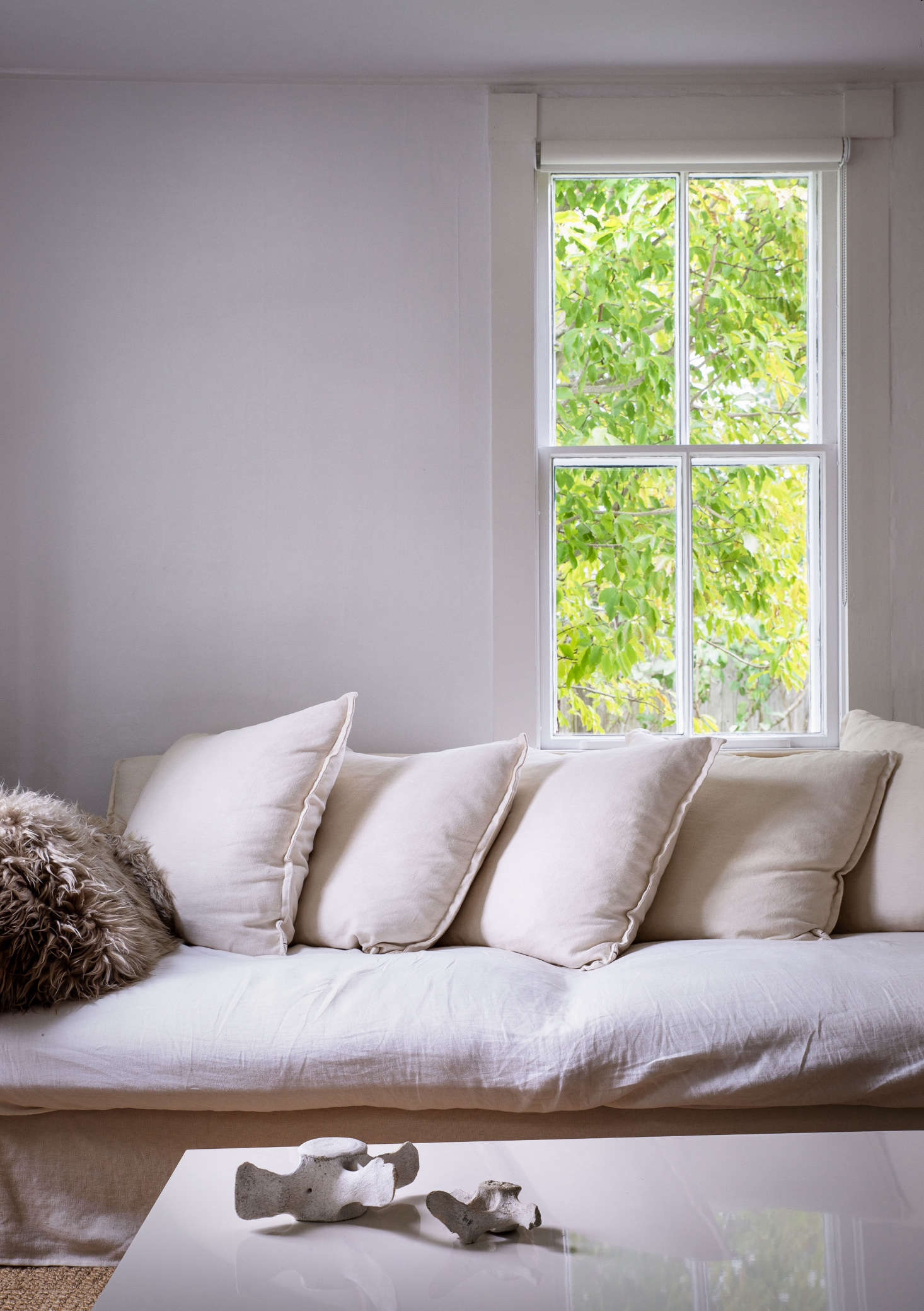 The multitude of generous windows is one of the most striking features of the home. Minimal roller shades, which they leave up most of the time, allow Jimmy and Ezra to take full advantage of the light, air, and views.
