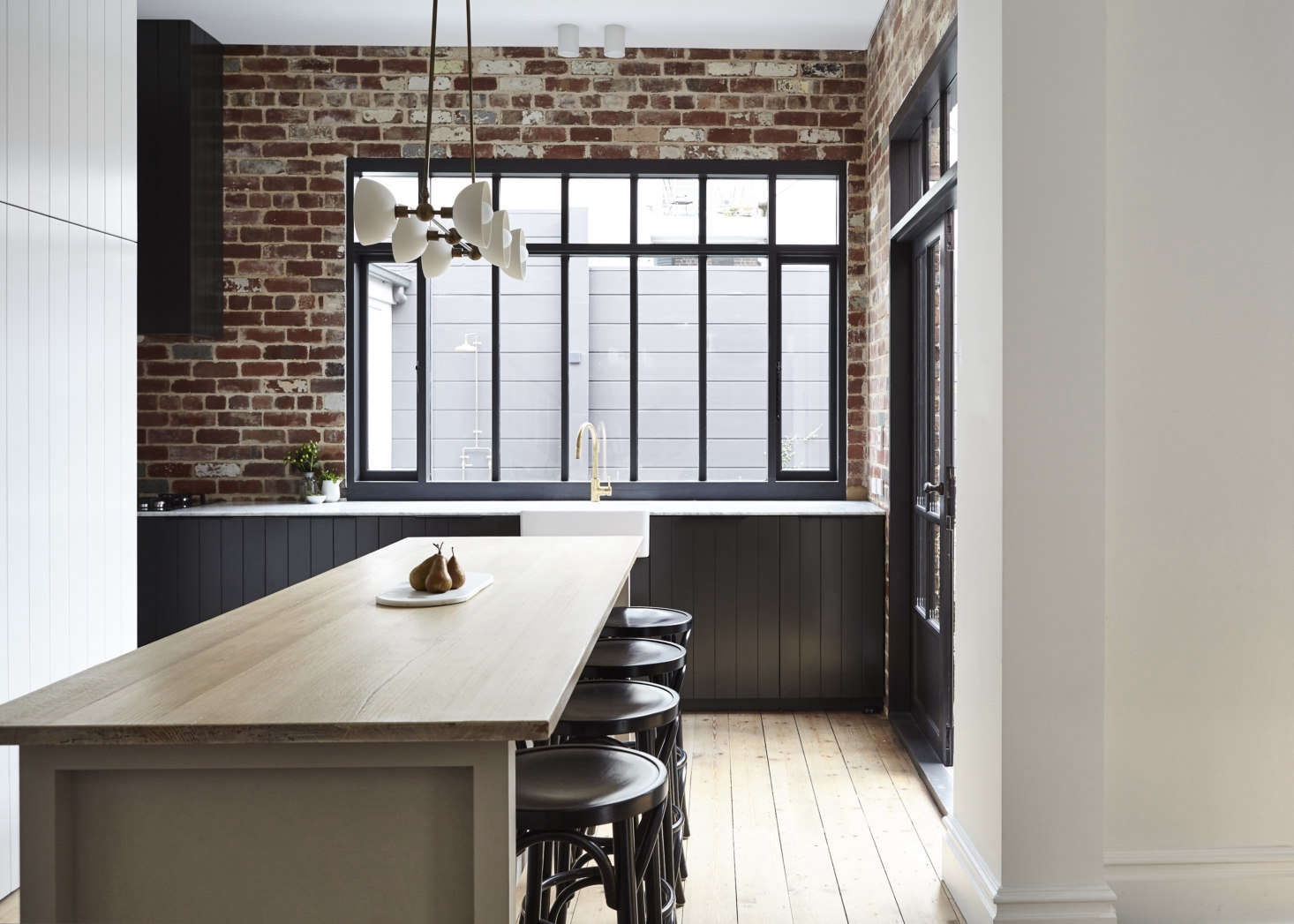 The north wall, overlooking the garden, was pushed out to extend the kitchen (see floor plan below).