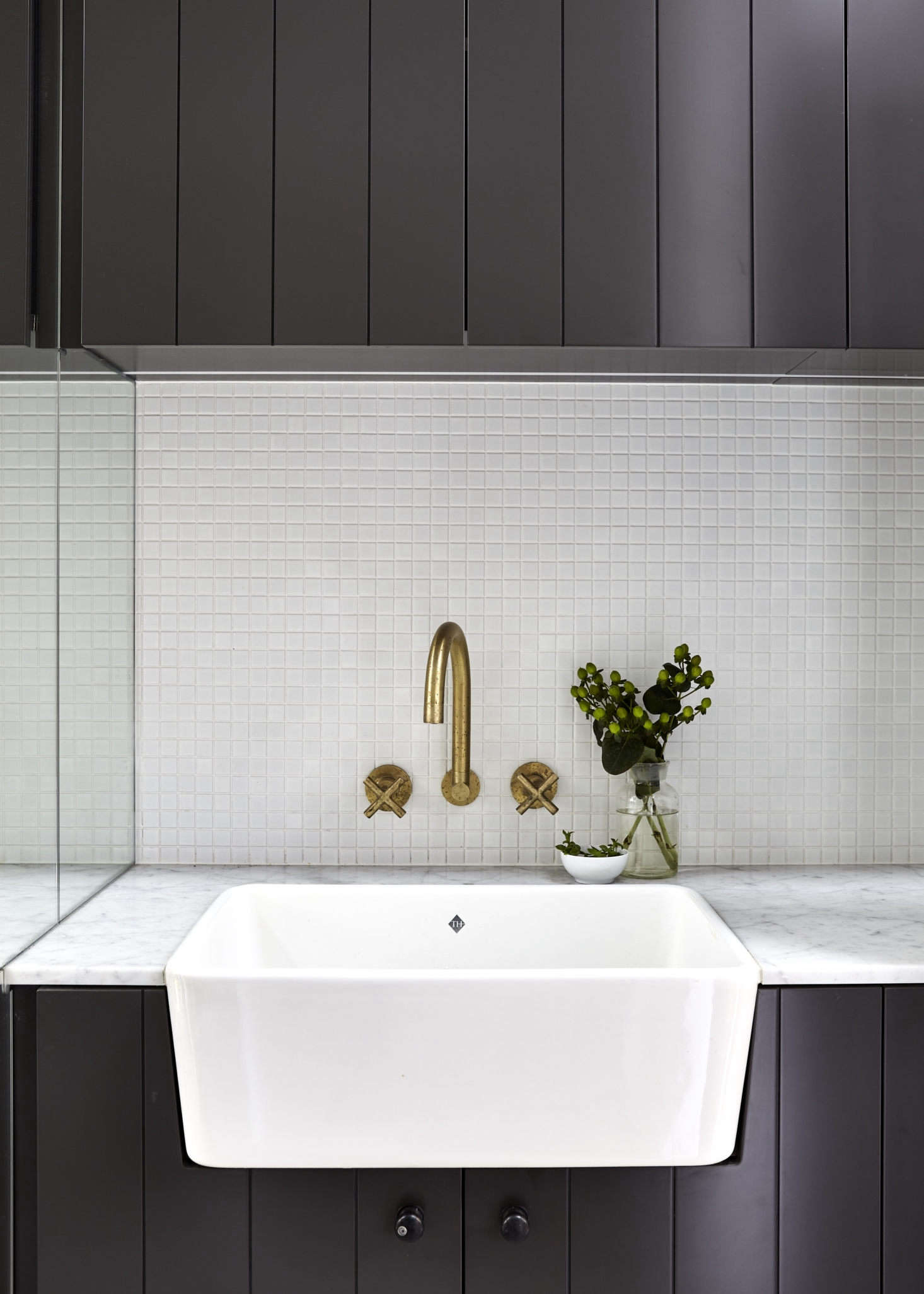 Like the kitchen, the powder room has a classic Shaw