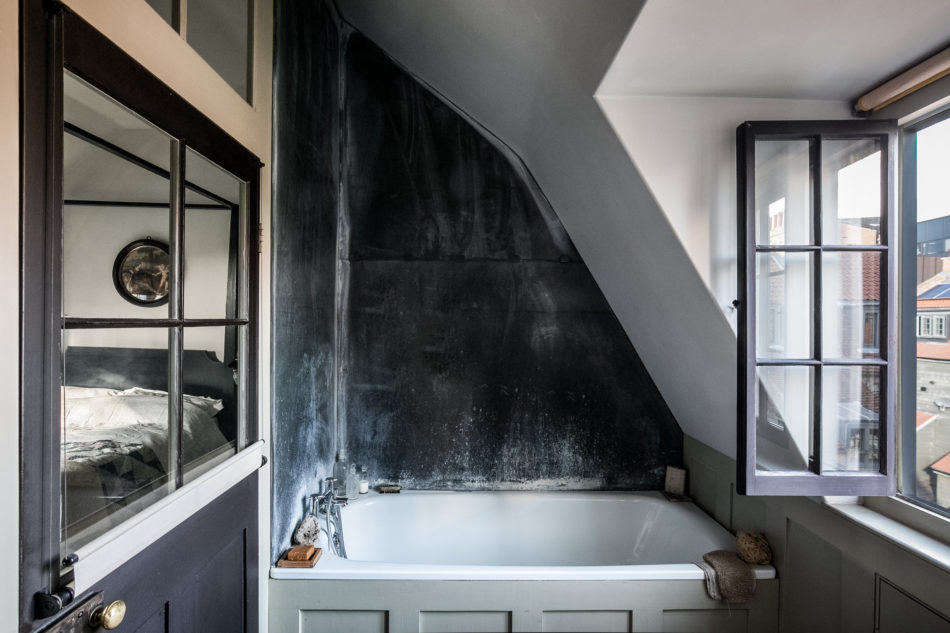 An ensuite bath, with rooftop views.