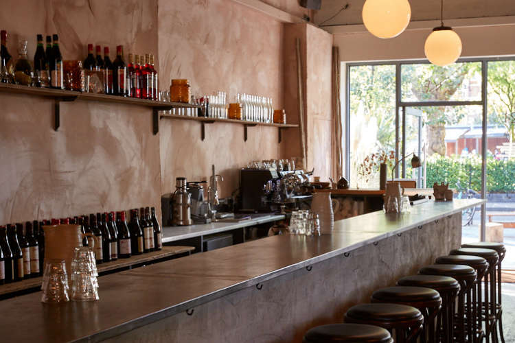 The uneven nude wall behind the counter is created using hydrolime (a combination of lime and plaster). Beneath the zinc counter, Jeremie has created a “mud wall” by incorporating the sawdust from on-site joinery into the hydrolime and applying it with a cloth.
