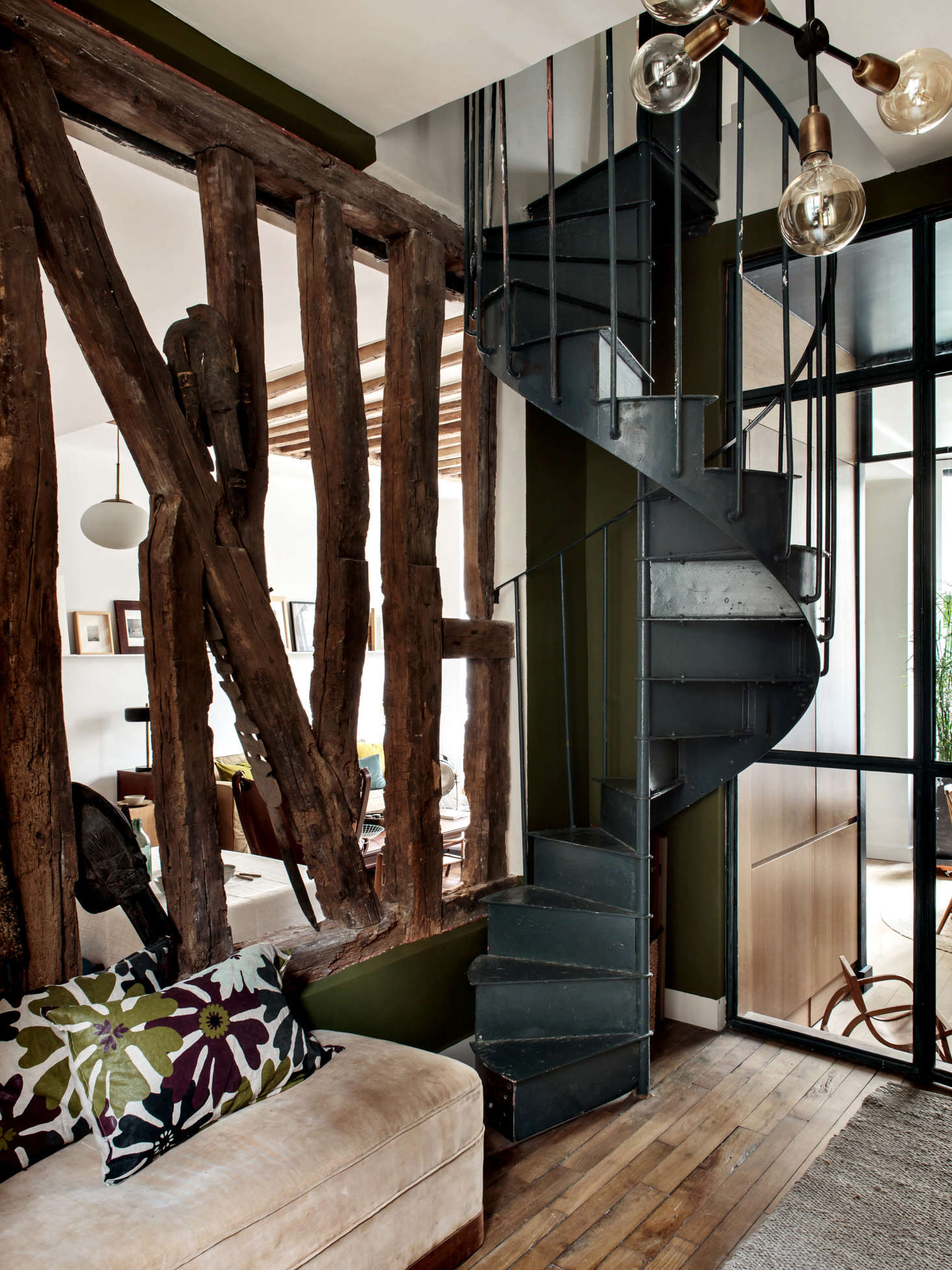 When Hermand took over the upstairs floor, she installed a century-old spiral stair to link the office to her living quarters.