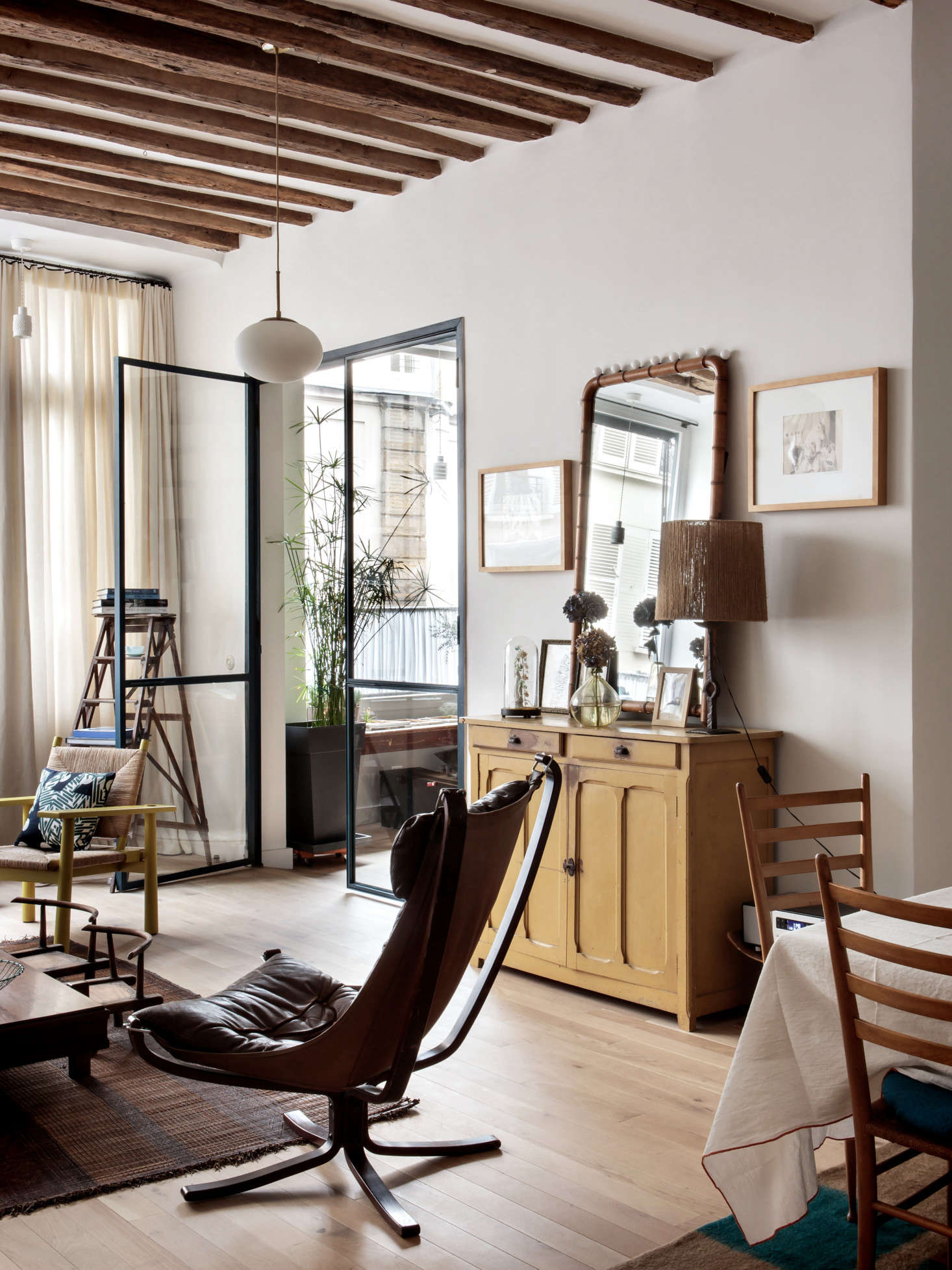 Atelier doors lead to the library. The walls are painted Farrow & Ball