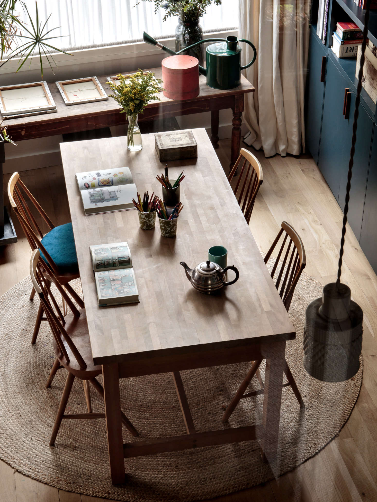 The table is an old Habitat design paired with chairs from Selency, a European digital marketplace specializing in vintage Scandinavian furniture. The Fancy Tall Pendant Lights are from Kathleen Hills