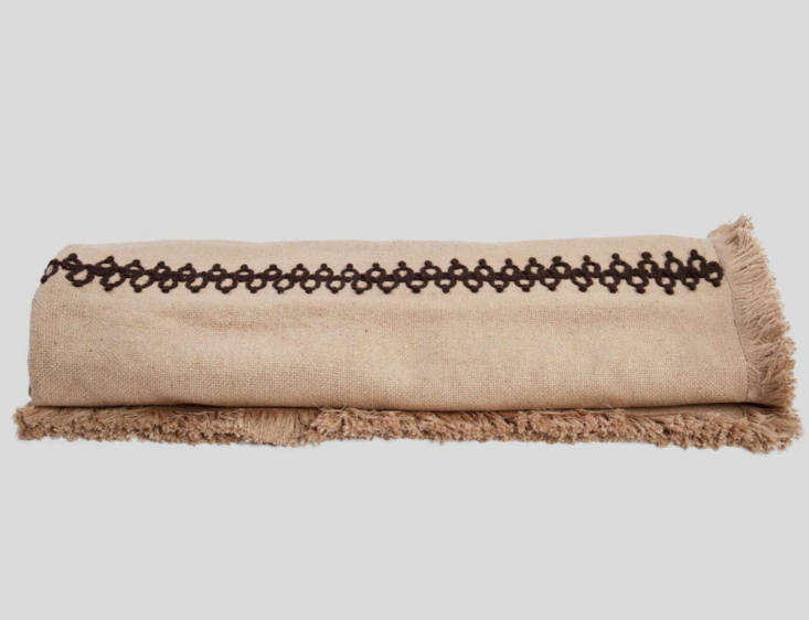 the silk jute milsom throw has understated black and brown embroidery with tone 19