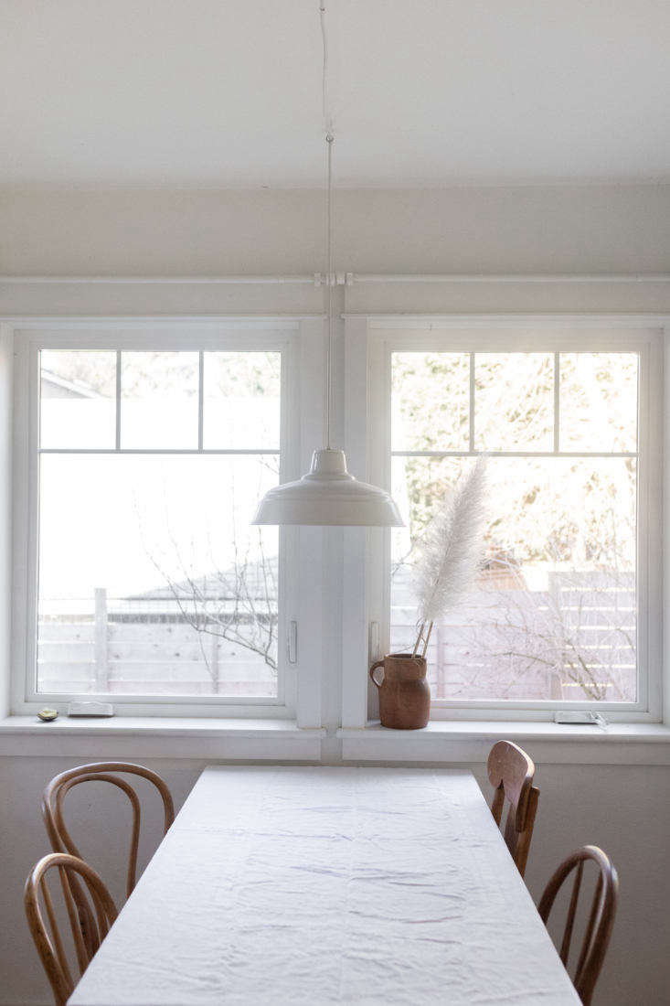 the sun room/dining room in the back of the house, with mix and match dining ch 25