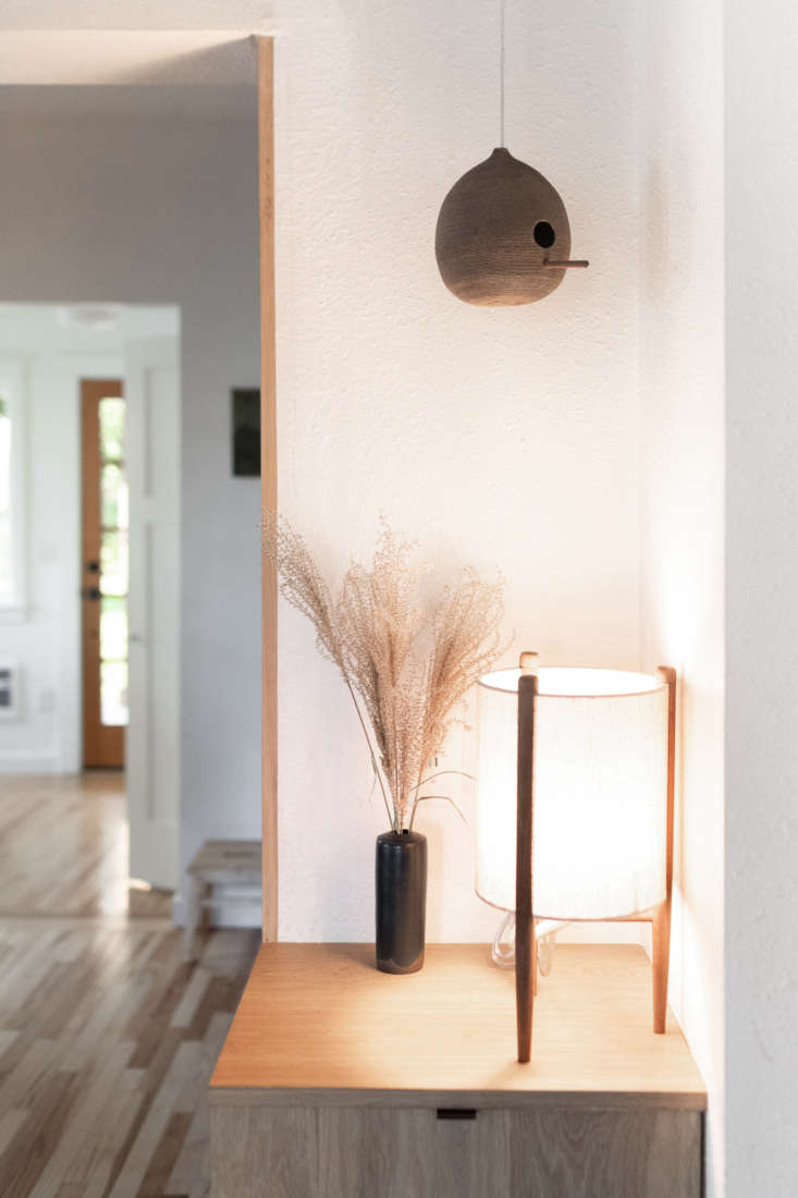 on a built in cabinet near the kitchen: the akeno table lamp from urban outfitt 27