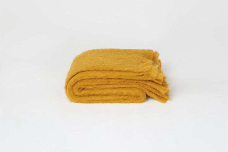 the toast mohair blanket in warm ochre also comes in a darker tobacco color; \$ 27