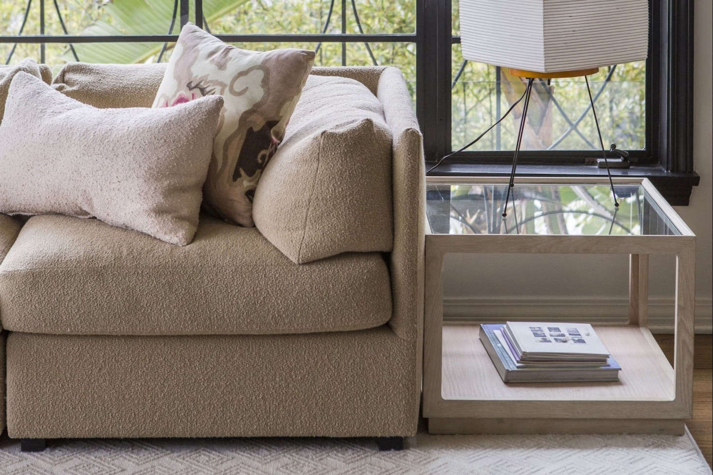 The Cube Table has a solid wood frame with a lower shelf and glass top (shown above in white oak); $data-src=