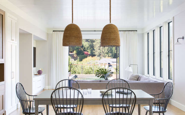 a window wall in the family room and dining area leads to the pool deck and ove 19