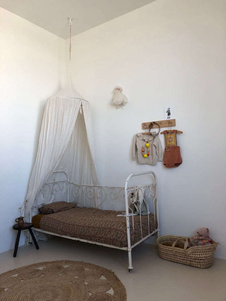 when kaatje is ready to migrate to her own room, an antique cast iron bed await 36